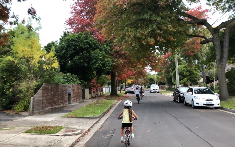 A young family enjoying a bike ride in the streets of Donvale