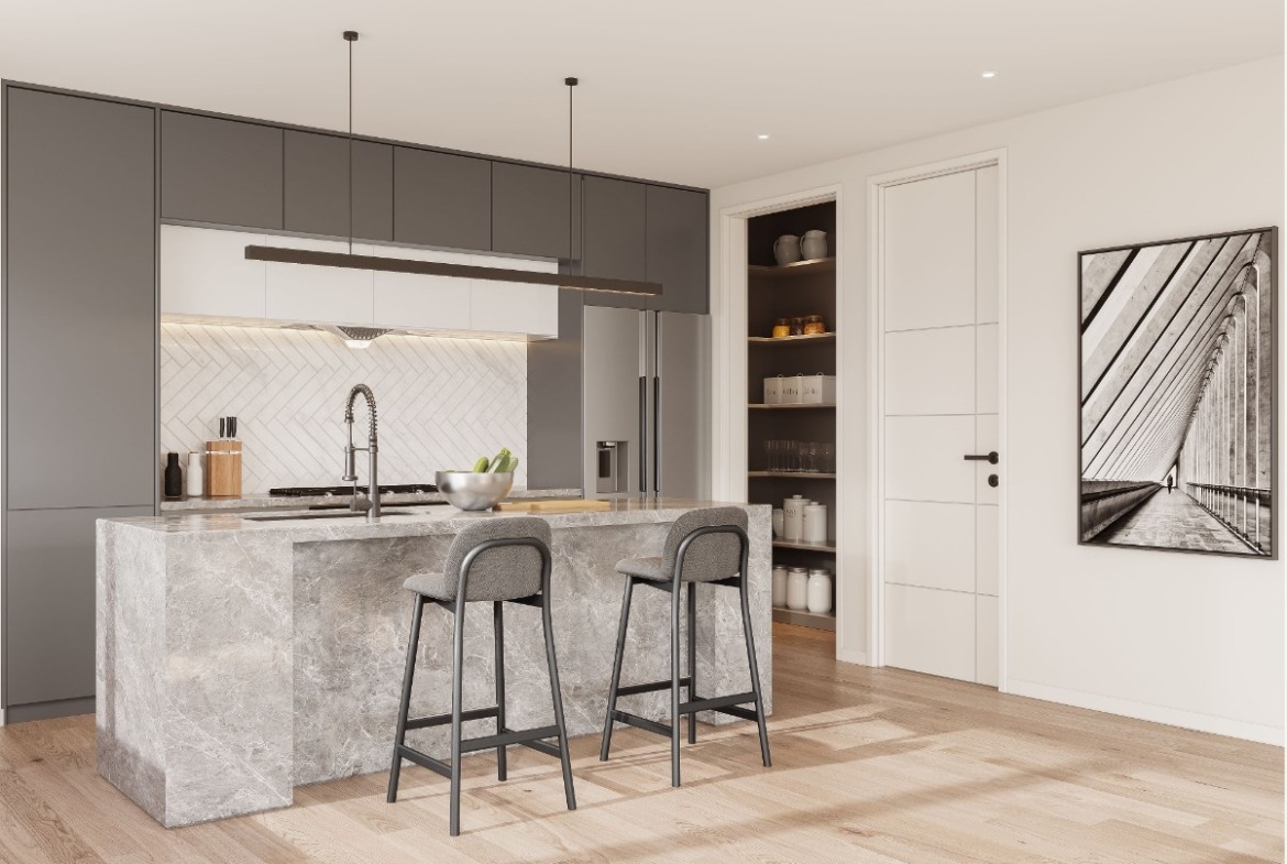 This image showcases the open floor plan and modern kitchen design. The benches feature stone bench tops, splashbacks, cupboards and timber flooring throughout.