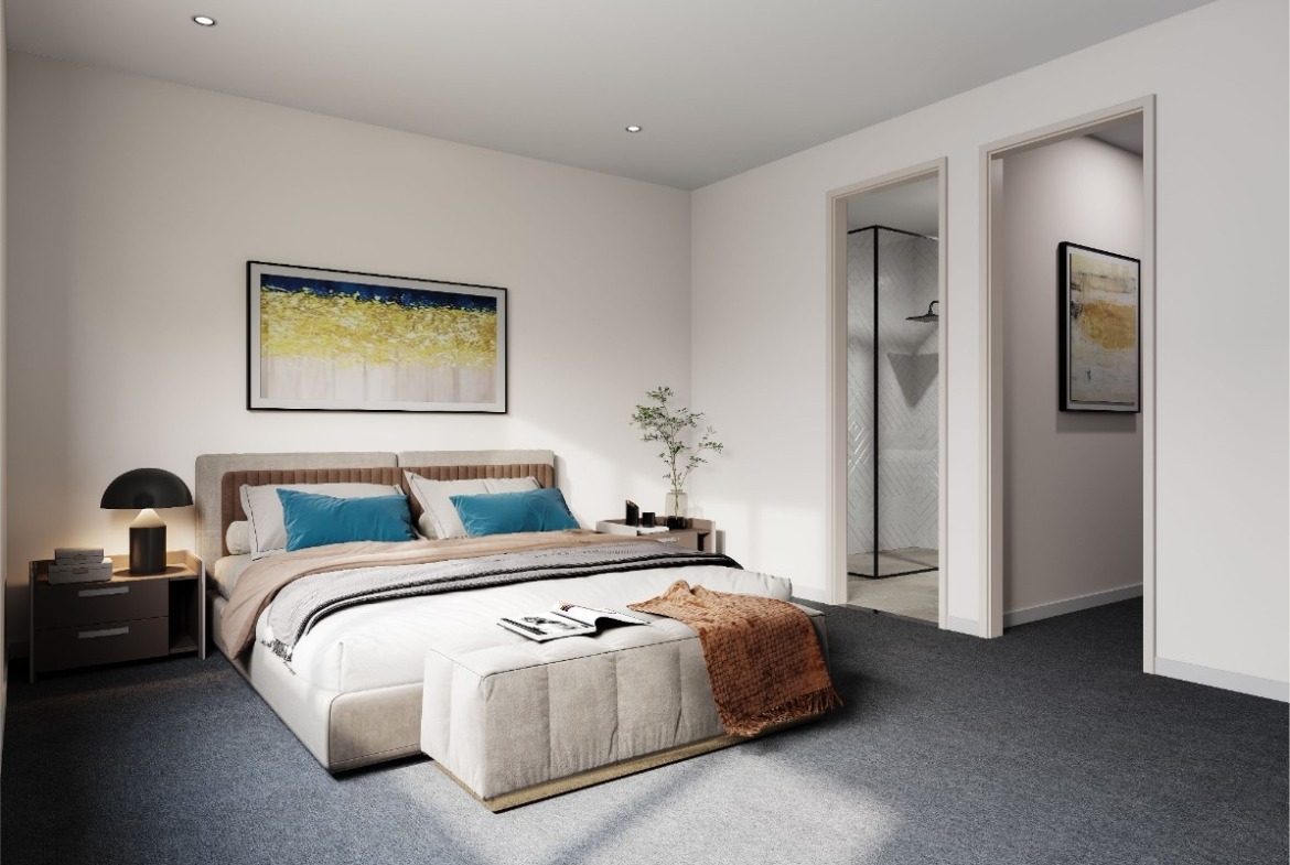 This image showcases the open floor plan and modern kitchen design. The benches feature stone bench tops, splashbacks, cupboards and timber flooring throughout.